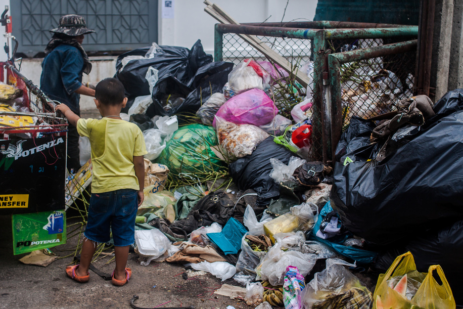 Children's Environmental Health in Thailand.

A child watches as his mother picks through waste in Sathom District, Bangkok.

Nearly one-third of the 6.6 million under-5 child deaths every year are associated with environment-related causes and conditions. Environmental risk factors often act in concert, and their effects are exacerbated by adverse social and economic conditions, particularly conflict, poverty, and malnutrition.