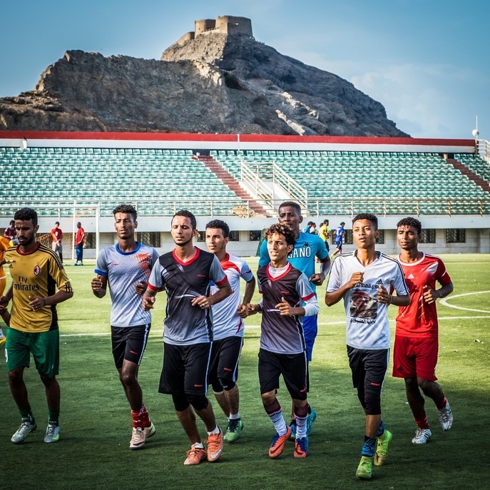 A group of young athletes during football practice at the Al-Tilal Sports Club stadium in Aden, Yemen.
