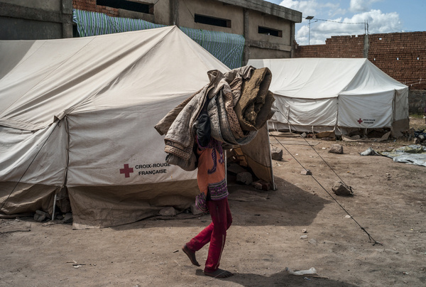 On 11 February 2022, a man walks by with a blanket at an accommodation site that was set up for people affected by rising waters in Antananarivo after the passage of tropical storm Ana and tropical cyclone Batsirai. Since January 2022, multiple extreme weather events have damaged homes and public infrastructure in Madagascar, resulted in the death of over 200 people, and left over 650,000 people without access to health care. WHO has been working with national health authorities and partners to respond, including by delivering essential medical supplies and sending experts to the affected areas.