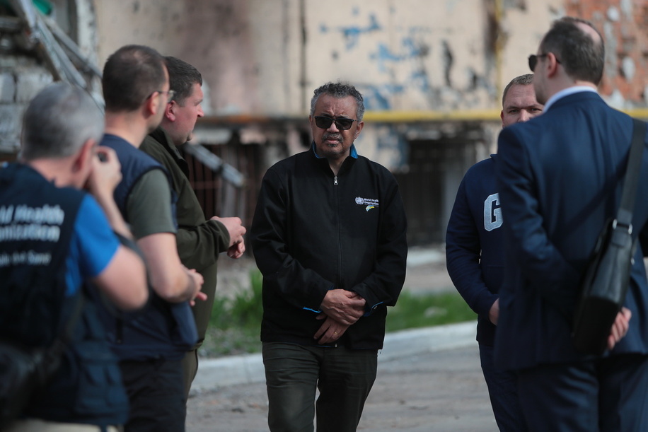 WHO Director-General Dr Tedros Adhanom Ghebreyesus in damaged residential area, Irpin, Ukraine, 07 May 2022. Since Russia invaded Ukraine, WHO has delivered trauma and emergency supplies for use in over 15,000 surgeries and enough medicines and healthcare equipment to serve 650,000 people.