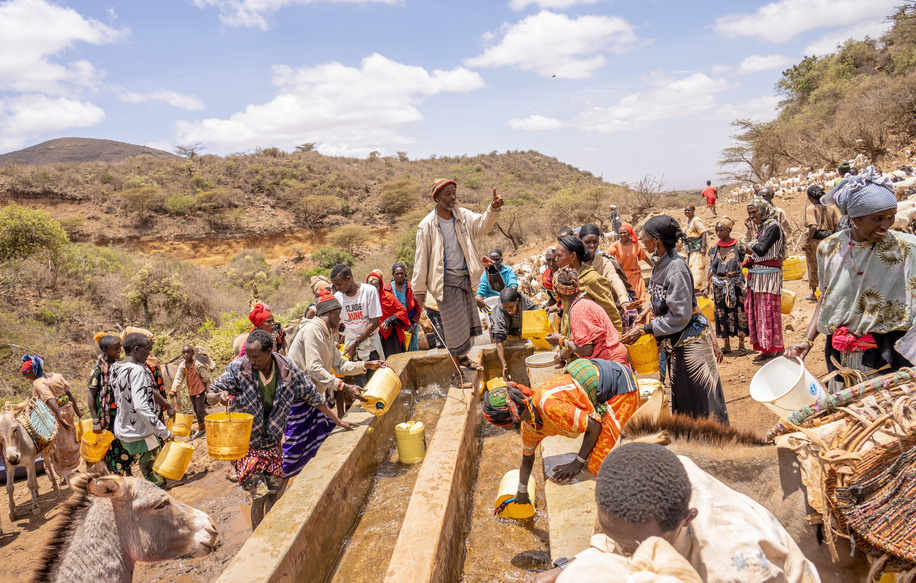 On 21 September 2022 Elama (centre) tries to help manage the water fetching process at Hula Hula Springs in Marsabit County, Kenya. With the ongoing drought in Marsabit, the spring is the only available water source for the whole community.   “The situation is getting out of hand,