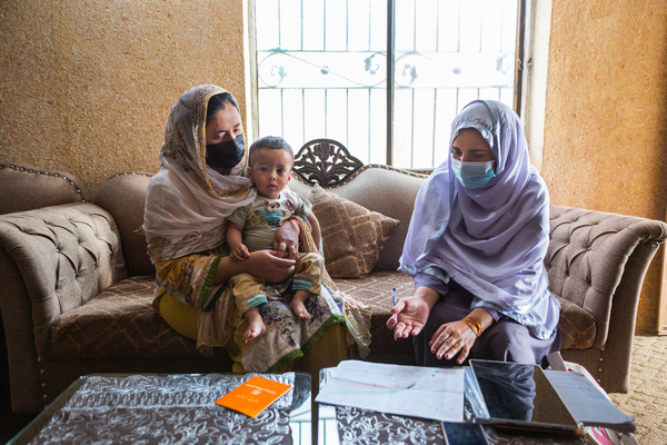 A health worker visits a woman and her 14-month-old son for a routine checkup at their home in Bara Kahu, Islamabad, on 25 March 2022, as part of outreach services of the “Lady Health Worker” programme. She checks the child’s weight to make sure he is healthy. She also provides guidance about various methods of contraception. “Lady Health Workers” are part a government health program supported by WHO to provide essential primary health services, including sexual and reproductive health and rights (SRHR), to underserved communities where they themselves often live. As of 2020, maternal mortality in Pakistan was 186/100 000 live births. About 25% of married women are using modern contraceptives, and the unmet need for family planning is 17%. There are 29 abortions per 1000 women of reproductive age. The adolescent birth rate is 46 per 1000. Among other achievements, WHO's SRHR Initiative in Pakistan has contributed to updating guidelines, including in-service and pre-service packages, establishing six centres for SRH services, and including misoprostol and a combination of mifepristone and misoprostol in the National Essential Medicines List.
