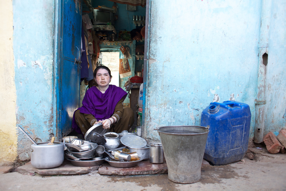 This series focuses on different aspects of having influenza in India.

A woman washes cooking pots and pans outside her home in a Delhi slum.