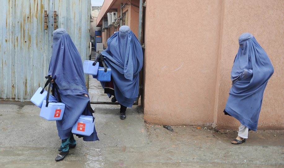 Polio vaccination campaign in Afghanistan. Afghan female supervisors get supply for their teams during the vaccine campaign days.