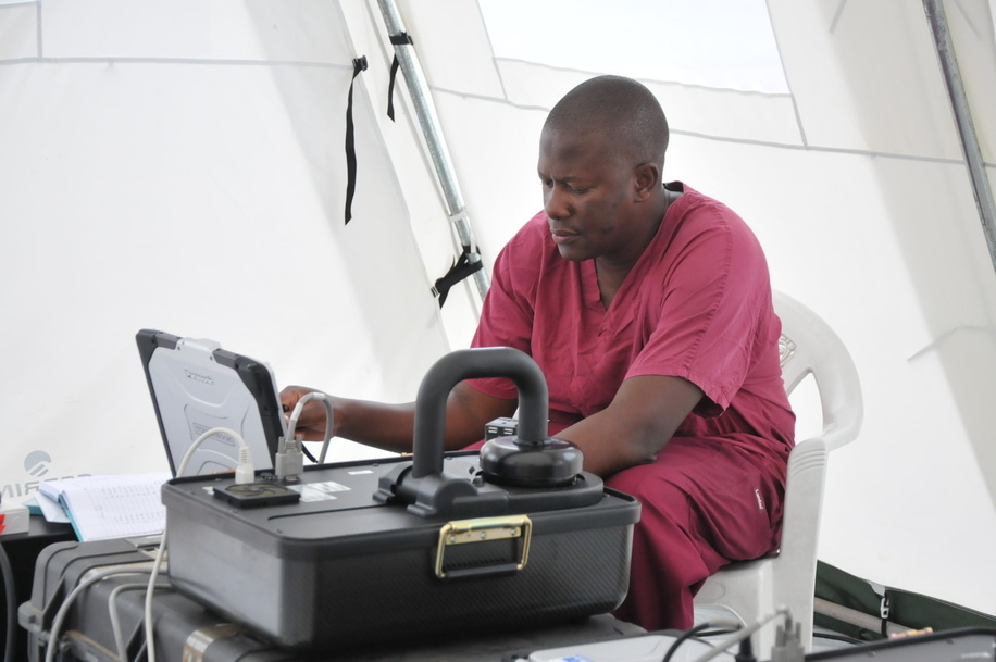 WHO and partner's response to Ebola virus disease (EVD) outbreak in Liberia.

Field mobile laboratory near ELWA 3 treatment facility is supported by CDC and WHO GOARN (Global Outbreak Alert and Response Network).

CDC staff monitors test results on a computer.