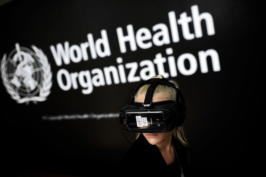 Seventy-first World Health Assembly, Geneva, Switzerland, 20-26 May 2018. A visitor to the interactive zone at the polio eradication stand uses virtual reality glasses.