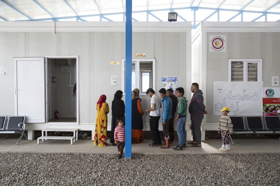 Medical Clinic in Debaga Two Refugee Camp
-
In March 2017 WHO began building a primary health clinic in Debaga 2 camp, south of Erbil in the Makhour District of northern Iraq. It receives 50-60 patients every day.

It employs 21 staff, including doctors, nurses, paramedics and laboratory technicians. They work on a rotating roster to provide healthcare 24 hours a day, seven days a week.

The clinic has seven caravans, which house examining rooms, a pharmacy, a small laboratory where blood and urine tests are conducted, a reproductive health centre, and a baby hut, where children’s height and weight are monitored. The clinic also provides routine vaccination against preventable diseases as well as health awareness and health education.
-
Caption was not provided by the photographer. Therefore, a generic caption has been applied to this image.