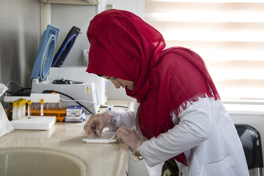 In March 2017 WHO began building a primary health clinic in Debaga 2 camp, south of Erbil in the Makhour District of northern Iraq. It receives 50-60 patients every day. It employs 21 staff, including doctors, nurses, paramedics and laboratory technicians. They work on a rotating roster to provide healthcare 24 hours a day, seven days a week. The clinic has seven caravans, which house examining rooms, a pharmacy, a small laboratory where blood and urine tests are conducted, a reproductive health centre, and a baby hut, where children’s height and weight are monitored. The clinic also provides routine vaccination against preventable diseases as well as health awareness and health education. - Caption was not provided by the photographer. Therefore, a generic caption has been applied to this image.