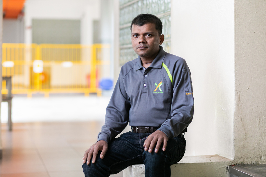 Singapore’s COVID-19 response is a collective effort of stakeholders from businesses, the community, and government. This includes working together with non-governmental organizations and more than 5000 migrant ambassadors who can engage with the migrant worker communities in their own languages.

Raju Sarker poses for a portrait at the dormitory where he lives in Singapore. Raju is a migrant worker from Bangladesh. He contracted COVID-19 and recovered after receiving medical care.
“Actually I could not feel when the disease came or when it left. I only remember going to the hospital with a cough and cold, but what happened after that, when and how I was treated, I don't know anything. It is only after I regained consciousness that I found out that I had contracted the disease and after that I suddenly received the news of my son's birth. With the help of the doctor's cell phone, I saw my son's photograph. After looking at my son I was filled with courage and joy. He gave me the inspiration and courage to survive, and the will to live.”