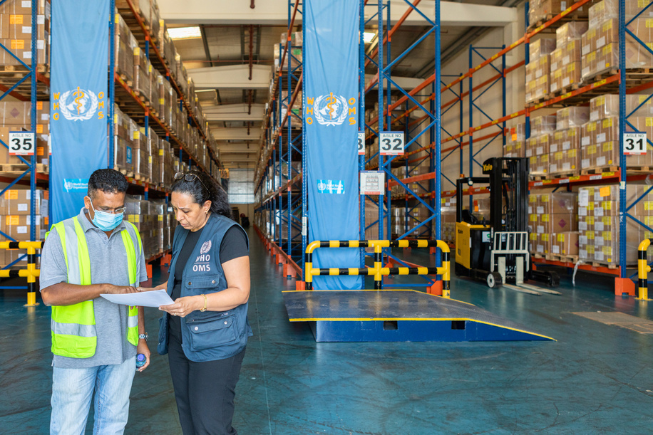 Stanly Godfrey, the head of the DHL team (left), and WHO’s Nevien Attalla (right), a pharmacist, inspect medical equipment and medication at a WHO warehouse in Dubai.

The World Health Organization’s Health Emergencies Programme maintains a Logistics hub located within the International Humanitarian City in Dubai. The WHO/Dubai operation maintains over 17,000 square meters of temperature-controlled warehousing and manages an inventory of medicines, medical supplies, and equipment valued at USD 40 million. The operation provides support to health emergencies across the globe in response to all types of events ranging from natural disasters to outbreaks of infectious disease. Since the start of the COVID-19 pandemic, the WHO/Dubai operation has expanded to over 4 times its original size and has completed over 324 shipments to 108 destinations across all 6 WHO geographic regions.
 
With the implementation of a WMS (warehouse management system) including bar-coding and scanning, the operation will gain significant efficiencies in managing inventory and rapidly dispatching supplies. The Operation established a dashboard to increase the visibility of supply chain data to support the tracking and monitoring of medical supplies dispatched from the logistics hub. Most recently, in response to the blast in Beirut, Lebanon the operation responded within 24 hours by delivering over 20 metric tons of trauma and surgical supplies; clearly demonstrating the rapid response capability and advantages of maintaining a pre-positioned supply of critical medical supplies and equipment.