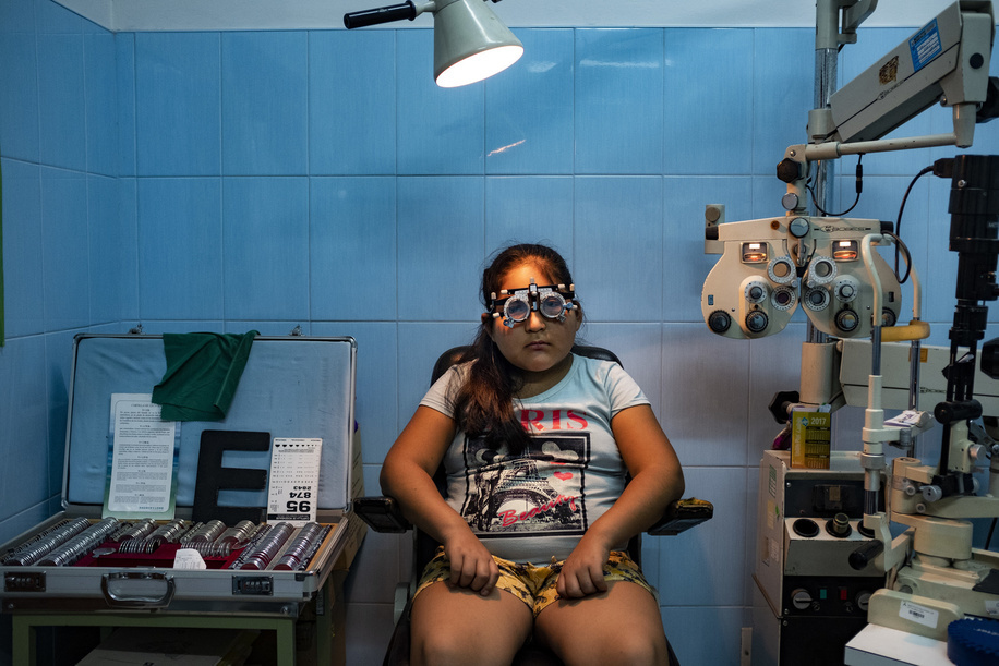 Lima - 20 March, 2018: Heidy Cordova Ramirez, 10 having her vision examination at the Maternal and Child Health Center Daniel Alcides Carrion in Villa María del Triunfo neighborhood in Lima. In this Health Center the priority is to have an early diagnosis on eye problems, from the kids to the elderly patients. They focus in cataracts, refractive errors, prematurity retinopathy, diabetic retinopathy, glaucoma as well as external diseases of the eye. Few years ago they even started to do their own cataract operations due the high number of patients with this pathology that they have and the over saturated health system in Lima.