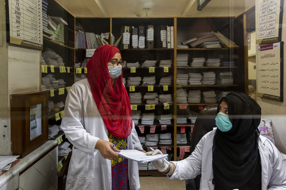 Sidra enters data of patients along with Maria Anjum at the reception desk at the Family Health Hospital on 1 February 2021 in Lahore, Pakistan. The hospital is primarily a female health clinic, which also does counselling for women experiencing gender-based violence. Approximately, 34% of ever married women in Pakistan have experienced spousal violence, either physical, sexual or emotional, in their lifetime.

In Pakistan, more than 1000 doctors, nurses, hospital administrators and community health workers, including midwives, were trained between 2018-2020 as part of the roll out of the clinical and policy guideline package by Pakistani's Ministry of National Health Services Regulation and Coordination and provincial health departments, with technical support from WHO and sister UN agencies, to strengthen the country health systems response to gender-based violence.