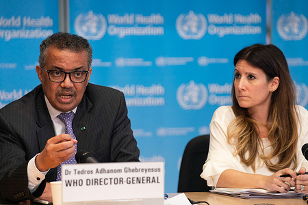 WHO Director-General Dr Tedros Adhanom Ghebreyesus speaking at a Media Briefing on COVID-19 in WHO headquarters, Geneva, Switzerland on 9 March 2020. https://www.who.int/director-general/speeches/detail/who-director-general-s-opening-remarks-at-the-media-briefing-on-covid-19---9-march-2020 Photo, from left to right: WHO Director-General Dr Tedros Adhanom Ghebreyesus and WHO Emergency Preparedness Programme Technical Lead Dr Maria Van Kerkhove. https://www.youtube.com/watch?v=zEmbPnm8BEY Title of officials and WHO staff reflects their respective positions at the time the photo was taken.