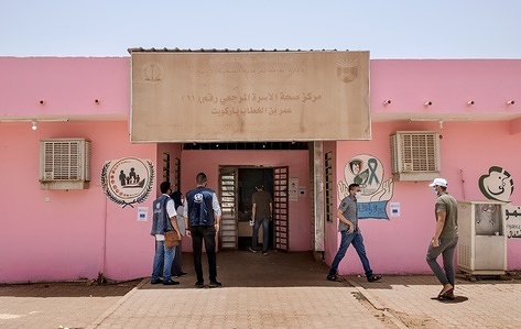 Khartoum, Sudan - 20 April 2022: The entrance to Omar Ibn Khatab Primary Health Centre. In collaboration with European Civil Protection and Humanitarian Aid Operations (ECHO), WHO has supported 105 primary health care centres in Khartoum, including this one, to upgrade infection prevention and control (IPC) measures as part of the COVID-19 response. The support included providing personal protective equipment (PPE), installing signage showing safety measures, creating a triage/screening system at health facility entrances, installing additional hand washing stations, supporting safe waste management and providing staff training. These measures have helped protect health workers and ensured service provision throughout the pandemic, and will serve to strengthen the health system beyond COVID-19. ECHO has also provided support for COVID-19 rapid response teams, isolation centres and laboratories in Khartoum.