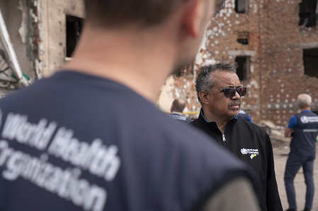 WHO Director-General Dr Tedros Adhanom Ghebreyesus near the ruins of a commercial and residential district in Irpin, Ukraine on 07 May 2022. The city is located on the outskirts of the Ukrainian capital Kyiv, some 20km from the center of the capital and was heavily damaged in March of 2022.