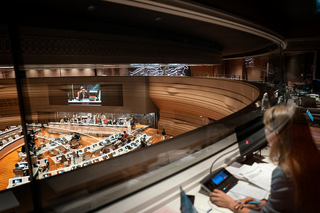 A view from behind a translation booth of Room XVII at the Palais des Nations during the first meeting of Committee B at the 75th World Health Assembly on 25 May 2022.