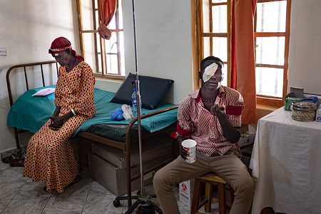 Lodwar, Kenya - 27 March, 2018: Paulina, 65 (left) and Lokichomo (right) in the post-operation room after they got operated in their eyes. Paulina had cataracts and Lokichomo had trachoma. They were operated at Lodwar County Referral Hospital. This Hospital in Northern Kenya is one of the few facilities in the region of Turkana where patients can have ophthalmologic consultation and eye related operations.    