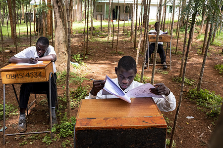 Homa Bay County, Kenya - 28 March, 2018: John, 14 during a exam at Ober Boys Boarding (Secondary). He is a visually impaired student at this educational institution, located near the Victoria Lake, which is pioneer in Kenya supporting kids with visual impairments.
