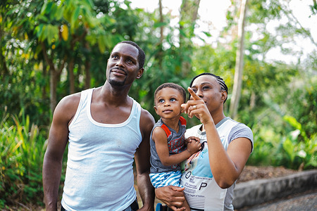 Rafuel with his wife Janella and their son Jemuel at French Fort, Tobago, on 20 March 2022. As a nurse at a health centre in Tobago, Rafuel participated in a chronic disease self-management course implemented by PAHO/WHO with the support of the Universal Health Coverage Partnership. The programme empowered people affected by noncommunicable diseases to manage their condition by making healthier choices such as getting a good night’s sleep, staying physically active, eating healthy and making informed treatment decisions. It also covered other important areas like problem solving, dealing with difficult emotions, communication skills and making an action plan. Participants like Rafuel also learned how to roll out the same training in their own communities and contexts, such as with religious groups and in health care settings.  Trinidad and Tobago, like many countries around the world, is facing a growing burden of noncommunicable diseases (NCDs) such as heart disease, stroke, cancer, diabetes and chronic lung disease. These chronic conditions account for over 62% of deaths each year, with three quarters occurring in people under 70 years old. Over half of the country’s population has 3 or more risk factors for NCDs, such as poor nutrition, physical inactivity and harmful use of alcohol and tobacco, placing them at greater danger of developing a chronic illness. The country’s experience shows that empowering and equipping communities to take charge of their health through prevention and self-management of NCDs - a primary health care approach - is an effective way to build healthier populations.   Trinidad and Tobago is among the 115 countries and areas to which the Universal Health Coverage Partnership helps deliver WHO’s support and technical expertise in strengthening health systems to achieve health for all.   https://www.uhcpartnership.net/story-trinidad-and-tobago/