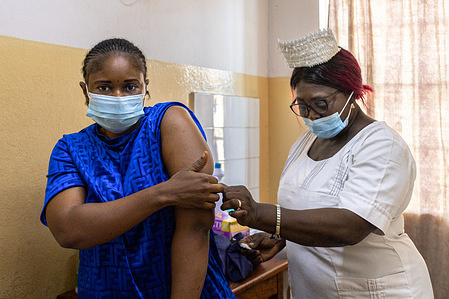 A nurse administers a depo-provera contraceptive injection for a patient at the Princess Christian Maternity Hospital in Freetown, Sierra Leone on 6 June 2022. Sierra Leone has one of the highest maternal mortality rates in the world; a high unmet need for family planning, high teenage pregnancy rates and unsafe abortions are contributing factors. There is a restrictive legal environment for abortion care with a law dating back to 1861. Most sexual and reproductive health services - including maternal health, post abortion care and family planning - are provided without cost as part of a free healthcare initiative in all public facilities in the country. Over the past few years, the Government of Sierra Leone has worked with WHO and partners, using a health system strengthening approach, to address gaps in sexual and reproductive health and rights (SRHR). The work has included integrating SRHR into their Universal Health Coverage roadmap, and a new “Safe Motherhood and Reproductive Health Bill,” in addition to the development and update of SHRH guidelines.