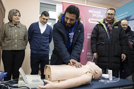 On 17 February 2023, Emanuele Bruni, WHO Incident Manager, Ukraine Response, uses a CPR training device at the training centre for medical students in Poltava Regional Clinical Hospital.