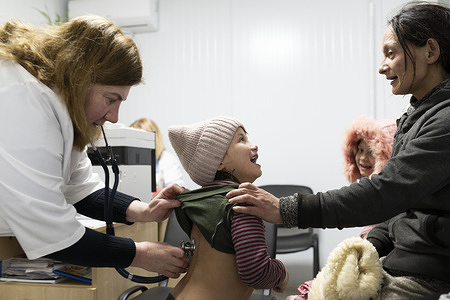 A child from the Roma community has a check-up at a community health care centre in Mukachevo district, Ukraine, before receiving her polio vaccine on 27 February 2023. Circulating vaccine-derived poliovirus type 2 (cVDPV2) was detected in Ukraine in 2021. Since that time, WHO and partners have been assisting Ukraine to respond to the polio outbreak. Thanks to the concerted efforts of WHO, international partners, national authorities and local communities, no cases of polio have been detected in the country for over a year. Related video: https://youtu.be/hqpxjOWBsyE