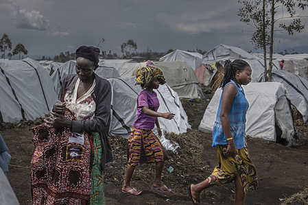 On 3 March 2023, Maisha (left), 57, stands in front of her shelter in Bulengo camp, about 15 kilometres from Goma in the east of the Democratic Republic of the Congo. She said that she had to flee her home about 1.5 months ago. "We have problems because there are no solutions for those who have chronic diseases, she said. "Here there are no toilets or showers, shelters are too small for families we are too exposed to disease." A group in the east of the country has taken up arms again, disrupting the already fragile humanitarian situation in the area. Since early April 2022, almost 900,000 people living in the territory of Nyiragongo, Rutshuru and Masisi have been forced to flee their homes to seek refuge in villages north and west of the city of Goma and other communities in the territory of Lubero. As of March 2023, more than 40,000 people were taking shelter in the camp of Bulengo. WHO and partners are helping to improve sanitation and are providing emergency health services for camp residents, but the needs in the area are enormous and more support is needed.