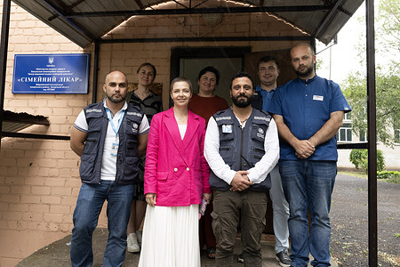 A WHO team with Mobile Health Team Coordinator I. Shkabarnya (centre left), WHO Ukraine Incident Manager Emanuele Bruni (centre right) and family physician Dr A. Bezboro (right) at a primary health centre in a remote community in Zaporizhzhia Oblast on 28 July 2023.  Related video: https://youtu.be/nKouoRP8_88?si=1KUUoVnHXEOnF4gz