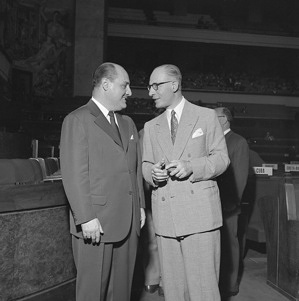 Dr Marcolino Gomes Candau (left) of Brazil talks with Dr Gerardo Segura, Director de Politica Sanitaria International, Argentina during the Sixth World Health Assembly. Dr Candau was nominated by the WHO Executive Board on 27 January 1953 to fill the post of Director-General of WHO. Title of WHO staff and officials reflects their respective position at the time the photo was taken.
