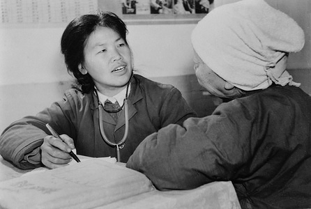 A village woman in Jishan county receives a thorough physical check-up from rural doctor Zhang Ruilien.