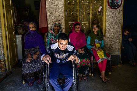 The siblings Anis, 14 and Nasheem, 19, in their family house during a field assistive technology survey for person with disabilities in the outskirts of Islamabad. They have never been properly diagnosed by a doctor but both of them have mental and body limitations that requires rehabilitation and training.