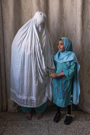 Patient with her mother during her rehabilitation and training process at the Pakistan Institute of Prosthetic and Orthotic Sciences in Peshawar (PIPOS).