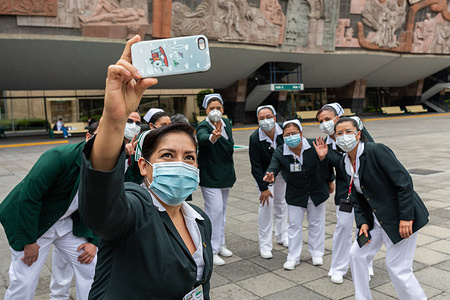 Nurses, along with the chief of nursing programs Fabiana Z. A. (back center), after an outdoor debriefing meeting at the Mexican Institute of Social Security (IMSS).