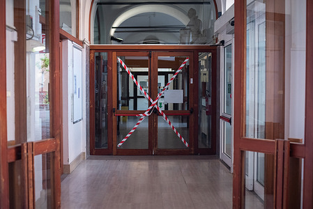 17 September 2020: Doorways are taped off as a COVID-19 prevention measure in one of the buildings at the St. Orsola-Malpighi Polyclinic in Bologna, Italy.  WHO has been collaborating with the hospital to improve the structural design of different buildings in response to COVID-19.  WHO helps reshape hospitals as COVID-19 eases its grip “We cannot redesign a hospital without considering how it will be used,” reflects Anja Borojevic, an Italian-speaking hospital readiness consultant working with WHO in Bologna, northern Italy, and liaising closely with local people. In a COVID-19 world, many hospitals need to rethink how they use their space. Italy is one of the first countries making adjustments as outpatient clinics and non-emergency services reopen. “Hospitals that were built in the 1950s or 1960s were conceived to respond to certain population needs, for example, to cope with diseases like tuberculosis. They then had to adjust to cope with chronic conditions and increased population sizes. Then came COVID-19 and shook things up,” says Anja. Rethinking hospital spaces Upon WHO’s request, Anja has visited over 20 facilities in Bologna and in the Apulia Region in southern Italy over 2 months. She advises on how to create alternative routes through hospitals for confirmed COVID-19 patients and for those suspected of having the virus, and on how to provide better spacing in waiting areas and improve ventilation. “What we are finding now in Italy is that there are fewer COVID-19 patients presenting with clear symptoms and more suspected cases, so we have to rethink the whole concept,” she adds. She explains that hospitals now need to think in terms of creating medium- and low-risk spaces as opposed to COVID-19 and non-COVID-19 wards. Anja points out that infection prevention and control (IPC) standards must be raised in all structures to avoid new infections occurring in hospitals. With a background in emergencies and epidemiology, she works alongside engineers, IPC teams and medical directors to gain a clear understanding of the needs of each hospital. “I visit all the structures which make up a hospital, but I also spend time with the staff who work in specific wards. I find out what difficulties they experienced during the COVID-19 acute phase, what they would like to change and how they can work more effectively in that space.” As well as structural adjustments, Anja sometimes recommends moving whole wards from one part of a building to another to increase capacity and to improve the flow of patients through the hospital. One of the biggest challenges, she highlights, is having to think entirely from scratch. Sustainable and fit-for-purpose hospitals Discovering the stories behind the original buildings and the way they have evolved over time is an enriching experience. Equally interesting, Anja insists, is the opportunity her role provides to collaborate with hospital staff and directors to reimagine the hospitals of the future. “We are taking this opportunity to rethink and build something sustainable and fit for purpose that can also be adapted to treat new diseases and emergencies, to avoid rebuilding in the future,” Anja says. She adds, “It is an exciting moment to be involved in these important conversations. On a daily basis, we are working with hospitals and facing the same problems on the ground that they face and we have a unique opportunity to find the solutions together. Those solutions can then be applied to other countries according to the COVID-19 phase they are in.”  