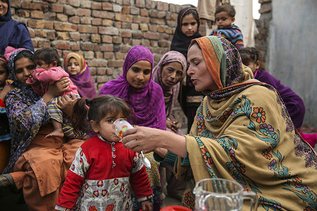 Rural health in Pakistan Azra Sabohi, Lady health Supervisor conducts a health session in that she demonstrates how to make Oral rehydration solutions (ORS), in Main colony, Sheikhupura district.