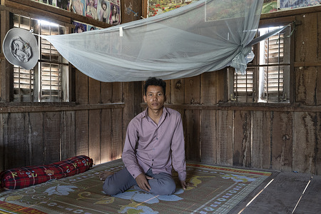 Thong Yim, 26, a recovered malaria patient, sits under a mosquito net in his house in Peam L’vear village in Cambodia on 29 January 2021. In 2020, men constituted 81% of all malaria cases in Cambodia. Kampong Speu province is located in one of Cambodia’s malaria hotspots. Malaria work in the province can be challenging due to high levels of multidrug resistance and the remaining infections predominantly coming from remote forested areas. Cambodia has been the infamous epicentre of resistance to various artemisinin-based combined therapies (ACTs) –the most effective treatment for malaria. In 2017, Cambodia’s National Center for Parasitology, Entomology and Malaria Control (CNM) launched a malaria intensification to deplete parasite reservoirs in high-risk populations by deploying technical support to provinces, strengthening coordination, and ensuring the full implementation of malaria interventions. Since then, Cambodia has reached historically low malaria incidence levels. In November 2020 the CNM launched the last stage of its intensification plan, a focalized aggressive approach to eliminate P. falciparum malaria by 2023. In Cambodia, this approach is known as the “last mile” of malaria elimination. The response is part of a broader initiative supported by WHO’s Mekong Malaria Elimination programme to eliminate malaria in the Greater Mekong subregion by 2030.