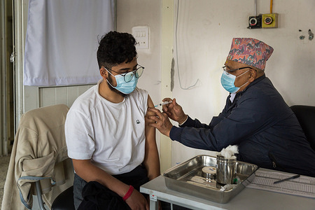 On 11 March 2021, Dr Suvranta K. receives COVID-19 vaccine at Paropakar Maternity and Women’s Hospital in Kathmandu, Nepal.