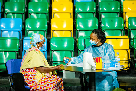 On 5 March 2021, a woman sanitizes her hands prior to receiving a COVID-19 vaccine in Rwanda. COVAX, the vaccines pillar of the Access to COVID-19 Tools (ACT) Accelerator, is co-led by the Coalition for Epidemic Preparedness Innovations (CEPI), Gavi, the Vaccine Alliance Gavi) and the World Health Organization (WHO) working in partnership with developed and developing country vaccine manufacturers, UNICEF, the World Bank, and others. It is the only global initiative that is working with governments and manufacturers to ensure COVID-19 vaccines are available worldwide to both higher-income and lower-income countries.