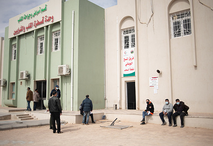 18 March 2021. People wait outside the COVID-19 testing area at Misrata Medical Center, Misrata, Libya. In response to COVID-19 in Libya, the Ministry of Health has established and equipped a new isolation centre in Misrata. WHO has supported the COVID-19 response in the country by providing technical guidance and delivering personal protective equipment (PPE) and other COVID-19 supplies.