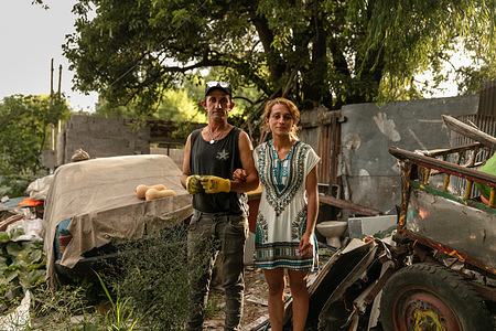 Portrait of Maria and Luis, standing in the front of their home a settlement located across from the main garbage dump in Montevideo, Uruguay, on 1 March 2021. - In Uruguay’s low-income neighborhoods, it is common for people to burn cables, discarded electronic equipment, batteries or other e-waste to recover metals for profit. In some settlements, large spots of burned lead can be seen on the street. Other contaminants include mercury and dioxides. While these “urban mining” activities are illegal, it is how many people make their living. E-waste is a health and environmental hazard, containing toxic additives or hazardous substances which damage the human brain, among other systems. The WHO Initiative on E-waste and Child Health was launched in 2013. With 25% of children in Uruguay now showing high levels of lead in their blood, one of the top priorities is protecting children from lead poisoning. Young children are particularly vulnerable to lead exposure as they absorb four to five times as much ingested lead as adults from a given source. Health consequences are serious as at high levels of exposure, lead poisoning attacks the brain and central nervous system, causing coma, convulsions, intellectual disabilities and even death. At lower levels of exposure, lead can affect a child’s brain development, resulting in reduced intelligence quotient and diminished educational attainment. Unidad Pediátrica Ambiental (UPA) is a national pediatric centre that specializes in environmental health and is connected to WHO’s Children’s Environmental Health programme. The centre is part of the toxicology department in the School of Medicine of the Universidad de la República, located inside the Claveaux centre of Health in Montevideo, Uruguay. UPA aims to prevent diseases that are generated by environmental contaminants, especially in children. Doctors at UPA treat children, adolescents, and pregnant women. UPA is also an education facility where both graduate and postgraduate students learn about and practice medicine related to toxicology and contaminants. Most patients come to UPA because of intoxications with lead, mercury, carbon monoxide or pesticides.