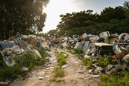 The Felipe Cardozo neighbourhood is a settlement located across from the main garbage dump in Montevideo, Uruguay, on 1 March 2021. - In Uruguay’s low-income neighborhoods, it is common for people to burn cables, discarded electronic equipment, batteries or other e-waste to recover metals for profit. In some settlements, large spots of burned lead can be seen on the street. Other contaminants include mercury and dioxides. While these “urban mining” activities are illegal, it is how many people make their living. E-waste is a health and environmental hazard, containing toxic additives or hazardous substances which damage the human brain, among other systems. The WHO Initiative on E-waste and Child Health was launched in 2013. With 25% of children in Uruguay now showing high levels of lead in their blood, one of the top priorities is protecting children from lead poisoning. Young children are particularly vulnerable to lead exposure as they absorb four to five times as much ingested lead as adults from a given source. Health consequences are serious as at high levels of exposure, lead poisoning attacks the brain and central nervous system, causing coma, convulsions, intellectual disabilities and even death. At lower levels of exposure, lead can affect a child’s brain development, resulting in reduced intelligence quotient and diminished educational attainment. Unidad Pediátrica Ambiental (UPA) is a national pediatric centre that specializes in environmental health and is connected to WHO’s Children’s Environmental Health programme. The centre is part of the toxicology department in the School of Medicine of the Universidad de la República, located inside the Claveaux centre of Health in Montevideo, Uruguay. UPA aims to prevent diseases that are generated by environmental contaminants, especially in children. Doctors at UPA treat children, adolescents, and pregnant women. UPA is also an education facility where both graduate and postgraduate students learn about and practice medicine related to toxicology and contaminants. Most patients come to UPA because of intoxications with lead, mercury, carbon monoxide or pesticides.