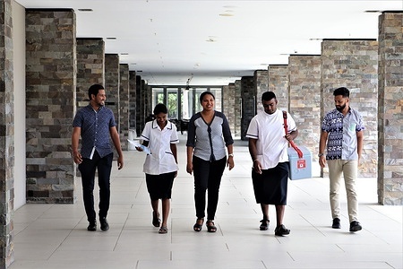 On 10 March 2021, medical teams who have trained at Sigatoka Hospital, Fiji are sent out to nearby resorts hosting quarantine guests to establish vaccination sites. These teams usually consist of a doctor, two nurses and data entry personnel. Fiji began its COVID-19 vaccine roll-out on 10 March 2021. The country welcomed its highly anticipated first batch of COVID-19 vaccines, supplied through the global COVAX facility, only 3 days prior. The first day of the vaccination was launched at Nadi International Airport. COVAX, the vaccines pillar of the Access to COVID-19 Tools (ACT) Accelerator, is co-led by the Coalition for Epidemic Preparedness Innovations (CEPI), Gavi, the Vaccine Alliance and WHO working in partnership with developed and developing country vaccine manufacturers, UNICEF, the World Bank, and others. It is the only global initiative that is working with governments and manufacturers to ensure COVID-19 vaccines are available worldwide to both higher-income and lower-income countries. These images were taken during a time of no community transmission of COVID-19. Community transmission is defined as the inability to relate confirmed cases through chains of transmission for a large number of cases, or by increasing positive tests through sentinel samples (routine systematic testing of respiratory samples from established laboratories). Preventative measures such as mask wearing and physical distancing should be used to prevent the spread of COVID-19.