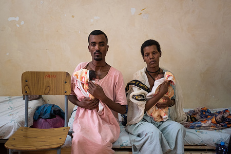 Solomon, 32, and his wife Agere, 28, each provide skin-to-skin care to their preterm twins at a KMC unit at Felege Hiwot Hospital in Bahir Dar, Ethiopia on 25 March 2021. Kangaroo mother care (KMC) is an effective way to prevent mortality in both preterm and low birth weight (LBW) infants. KMC is prolonged skin-to-skin contact for the baby with the mother or other caregiver for as long as possible during day and night, as well as exclusive breastfeeding or breast milk feeding. Fathers and other caregivers can also provide skin to skin care. Among infants born preterm or LBW, KMC has been shown to reduce infant deaths by as much as 40%, hypothermia by more than 70%, and severe infections by 65%. Mothers remain with their babies from birth to be able to breastfeed and practice skin-to-skin contact as part of KMC. KMC is one of the most cost-effective ways to increase survival of LBW and preterm newborns in low-income countries like Ethiopia. KMC was first introduced in Ethiopia in 1996 at the Black Lion Hospital. Since then, with support from WHO, KMC services have been expanded to other hospitals and health facilities including the Felege Hiwot Hospital, in Bahir Dar. Globally, with 15 million babies born preterm (before 37 weeks) and 21 million born LBW (under 2.5kg) each year, these infants face significant health risks, as preterm-related complications are the leading causes of death of newborns. Hence, WHO advises that KMC should continue amid the COVID-19 pandemic. This is due to the proven critical importance of ensuring newborns have close contact with parents after birth, especially for those born LBW or preterm.